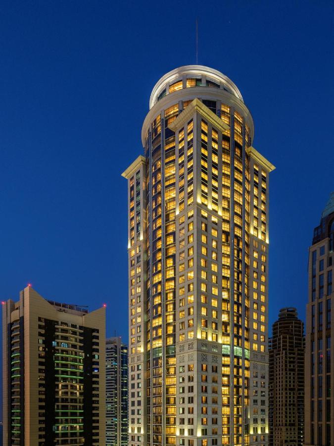 Dusit Hotel & Suites - Doha Exterior foto The hotel at night